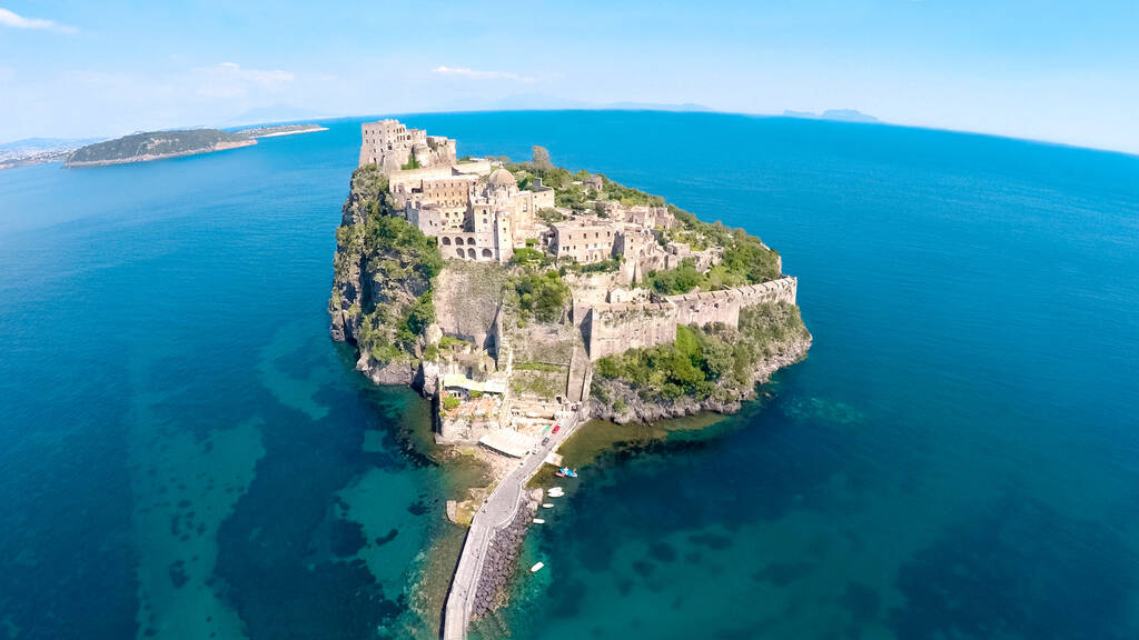 Beautiful historical monument in Ischia, castle on volcanic island, aerial view