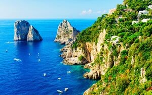 Capri Island with Faraglioni of Italy at Naples. Amalfi scenery and Solaro mountain. Landscape with Blue Mediterranean Sea at Italian coast. Panorama of Anacapri in Europe. View in summer.