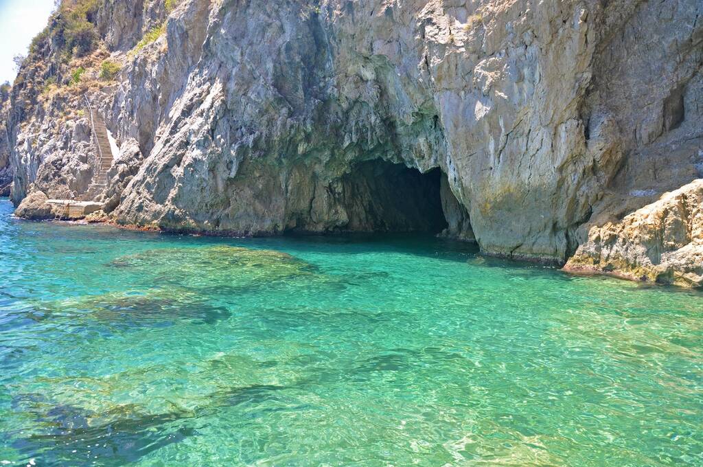 The attraction of the Amalfi coast - Green grotto with colorful walls and emerald water