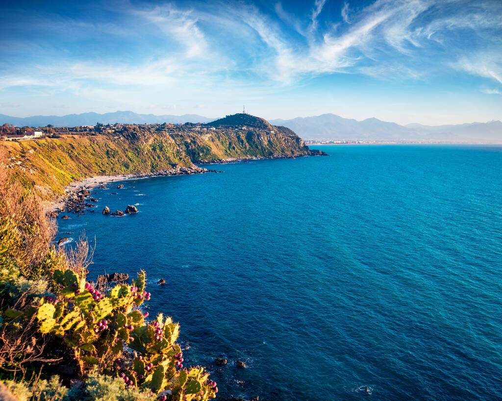 Impressive morning view of Milazzo cape with nature reserve Piscina di Venere, Sicily, Italy, Europe. Tropical spring seascape of Mediterranean sea. Beauty of nature concept background. 
