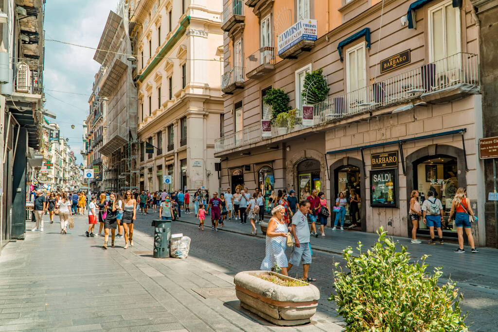 Naples, Italy - August 6, 2020 - people walking in Via Toledo shopping street in central Napoli, Campania