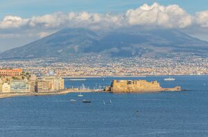 Naples, Italy - built during the 15th century, Castel dell'Ovo (Egg Castle) is a seaside castle located in the Gulf of Naples. Here the fortress with Mount Vesuvius in the background