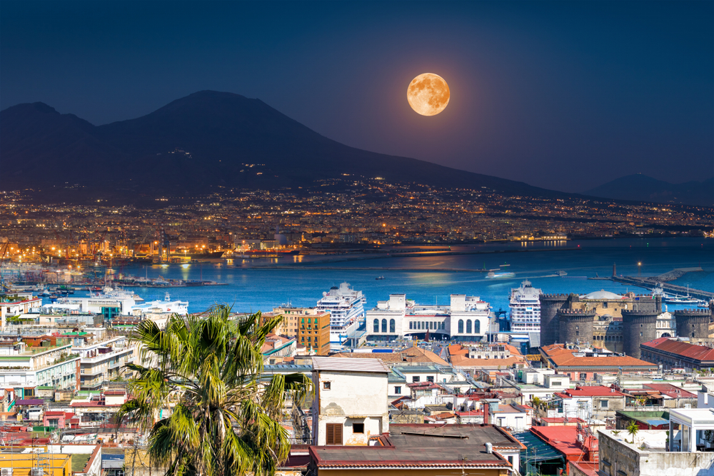 Mount Vesuvius, Naples and Bay of Naples, Italy. Opposites in nature: day and night, light and darkness. Elements of this image furnished by NASA.