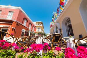 na Capri, Wicker chairs and tables on a picturesque square in Capri, Italy