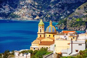 Pamiątki z Praiano, Praiano town on Amalfi coast, Mediterranean sea, Italy, view of the domes of San Gennaro church and Positano town