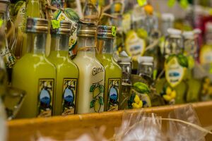 Pamiątki z Praiano, Small limoncello bottles for sale in a souvenir shop in Italy; typical Italian souvenir; lemon liquor